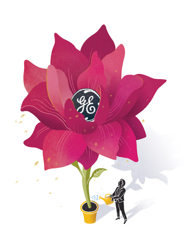 General Electric executive Ann Klee watering a large flower